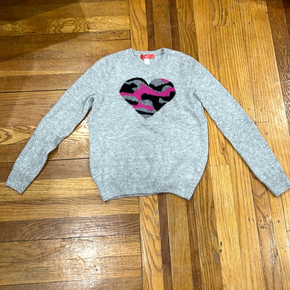 this is an aqua girl sweater in a size 10 cashmere with an animal print  heart.